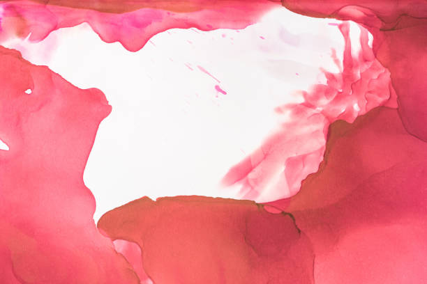 istock red and brown splashes of alcohol inks on white as abstract background 1062131824