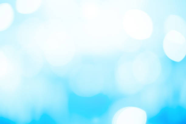 blur blue color background with motion bokeh light effect for design as happy new year card , merry christmas ,banner ,ads concept