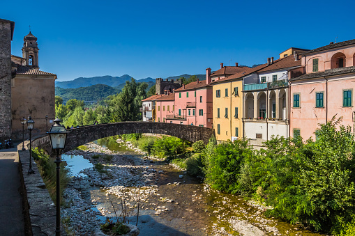 Tuscan town of Pontremoli with a view of the colorful palazzi on the banks of the river Magra. Pontremoli is a town in the region of Tuscany, Italy.