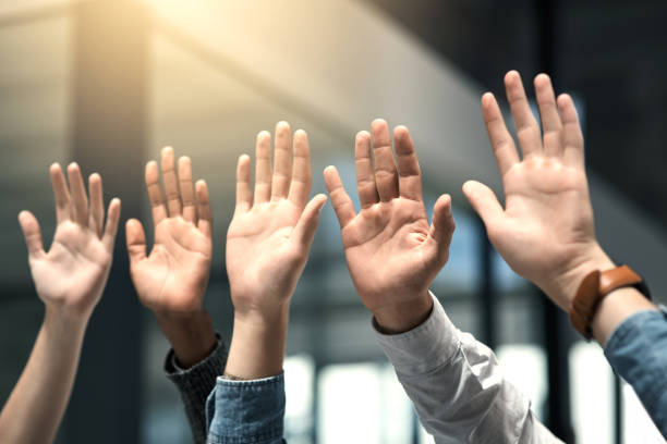 istock Raise your hands if you support your team 1062137678