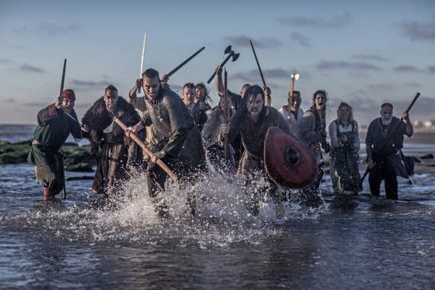 A hoard of Weapon wielding viking warriors A hoard of Weapon wielding viking warriors on a battlefield armory photos stock pictures, royalty-free photos & images