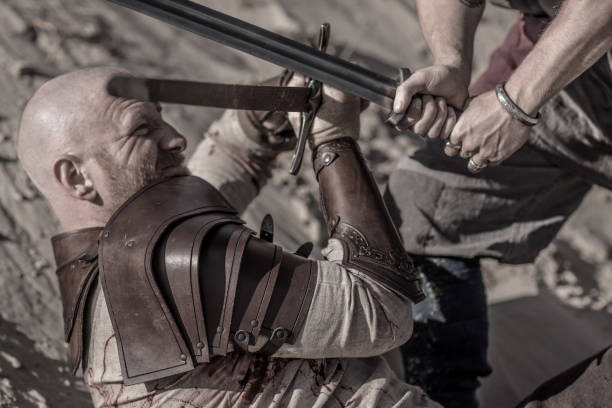istock Two viking warriors in action on a beach at the water's edge 1062153910