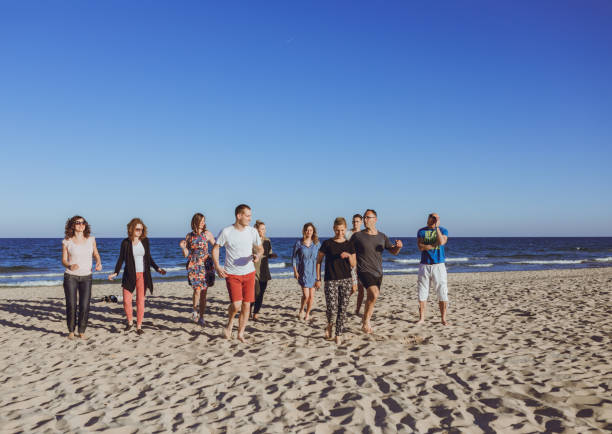 istock Group of friends dancing on the beach 1062156784