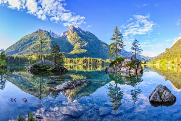 istock Lake Hintersee with blue sky and clouds in spring - XXXL Panorama 1062158676