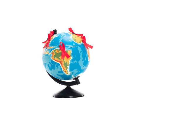 istock globe with red ribbons isolated on white, world aids day concept 1062159566
