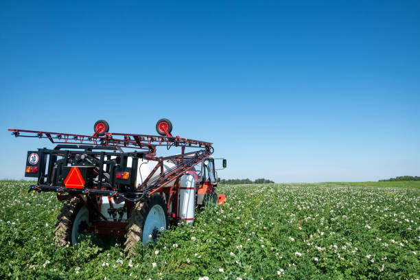 istock red tractor sprayer in the field 1062161686