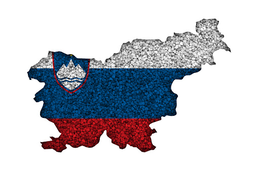 Map and flag of Slovenia on poppy seeds