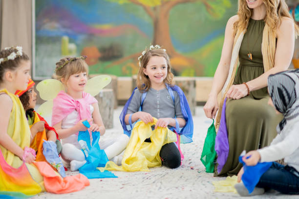 istock Playing dress up with an elementary school teacher 1062165692