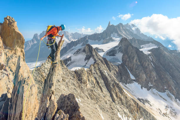 istock Mountaineer climbing in the mountains 1062167202