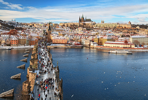 People and tourists walking over the famous Charles Bridge in Prague, Czechia, a few days after the restrictions for the Covid-19 pandemic were lifted.