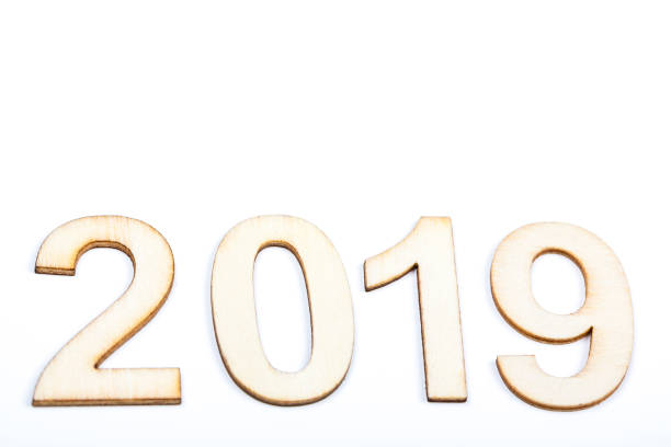 istock 2019 year celebrate with wooden numbers on white background 1062168612