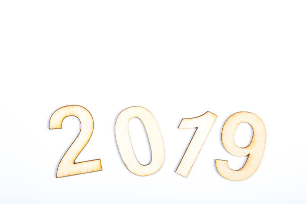 istock 2019 year celebrate with wooden numbers on white background 1062168772