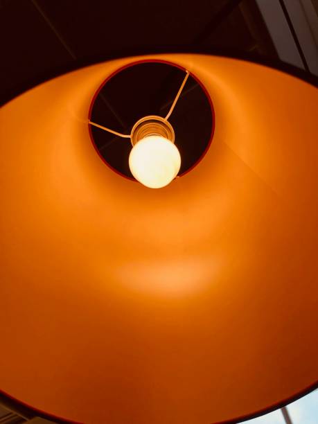 istock Warm orange toned lampshade seen from below 1062171066