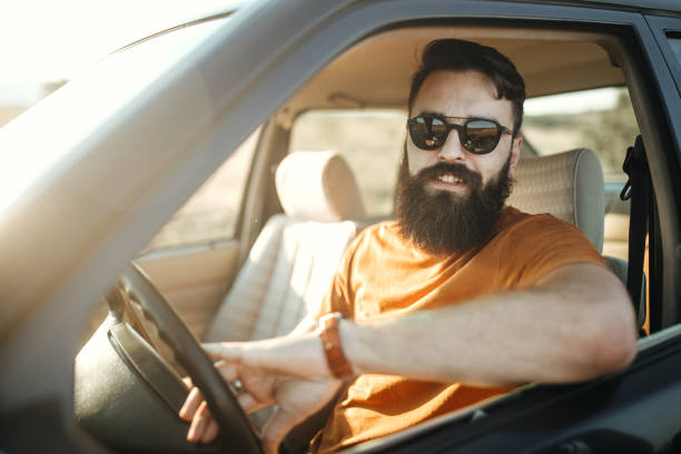 istock Hipster man traveling by car 1062174194