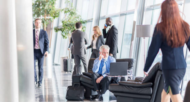 istock Businessman Working While Sitting In An Airport 1062174808