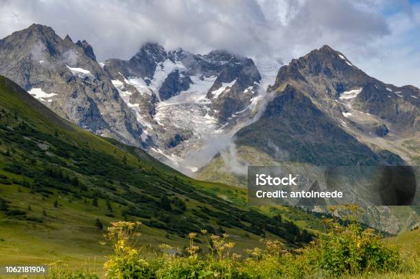 Rocky Cliff With Snow And Green Grass In Jura Mountain France Stock Photo - Download Image Now