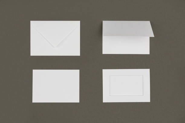 istock top view of white envelopes and cards isolated on grey 1062186974