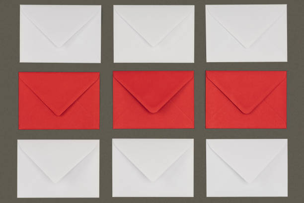 istock top view of closed red and white envelopes isolated on grey background 1062187004