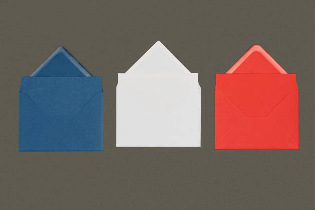 istock close-up view of blue, white and red envelopes isolated on black 1062187050