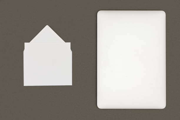 istock top view of white envelope and digital tablet isolated on black 1062188118