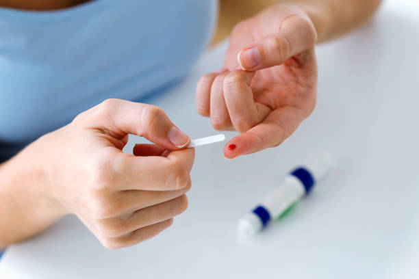 istock Young woman doing a diabetes control test blood sugar with glucose test. Incorrect process concept. 1062188754