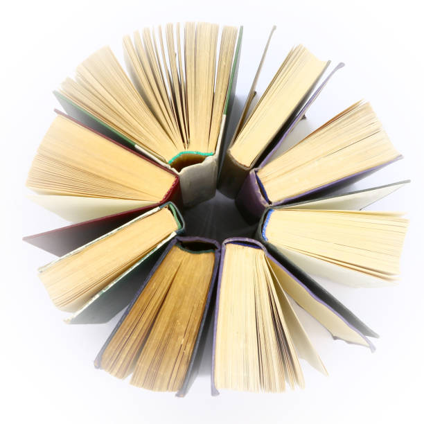 istock stack old hardcover books located in circle, isolated 1062188812