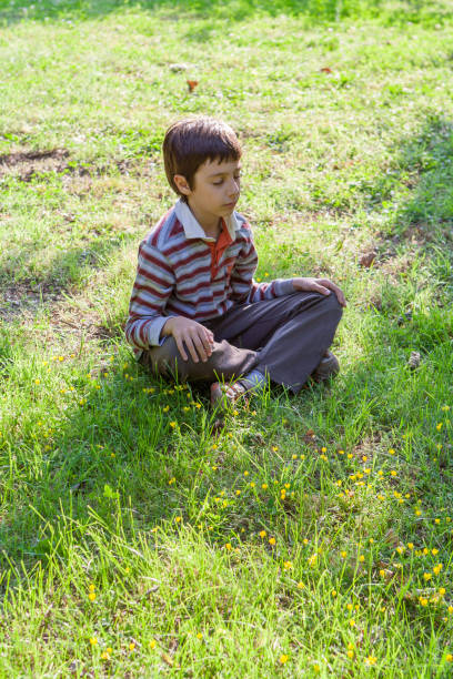 istock Child in Yoga Position at Pubblic Park 1062192734