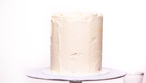istock Icing tall birthday cake with white buttercream icing. 1062193694