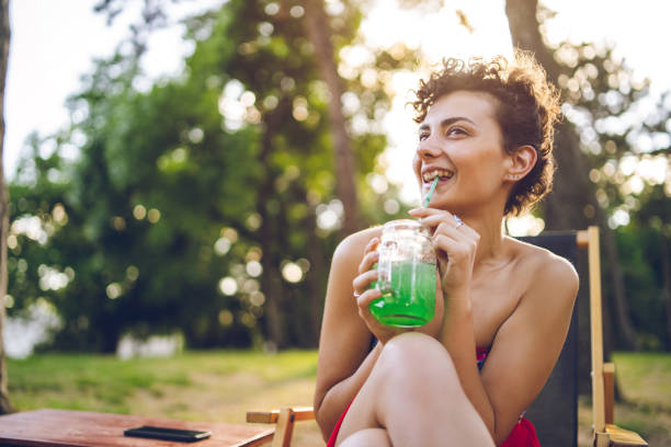 istock Girl drinking juice 1062196272
