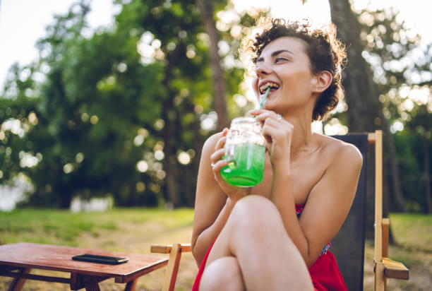 istock Girl drinking juice 1062198106