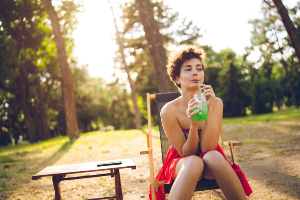 istock Girl drinking juice 1062202432