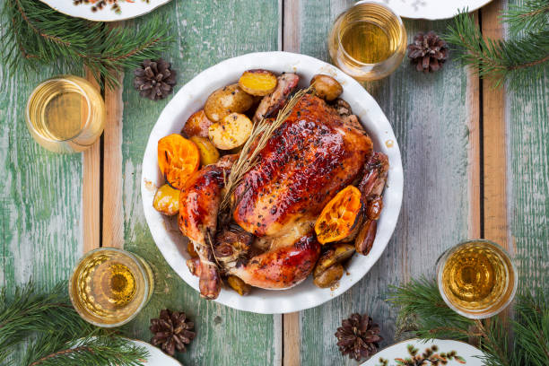 istock Roasted whole chicken with potatoes and tangerines 1062205150