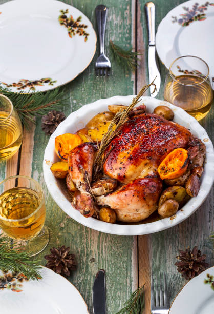 istock Roasted whole chicken with potatoes and tangerines 1062205212