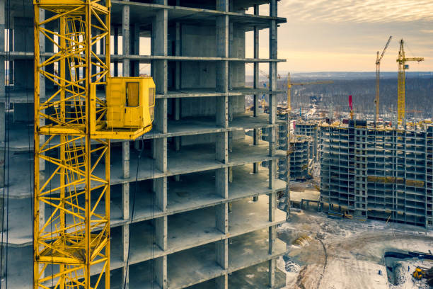 istock Construction crane next to the house under construction from a height 1062205924