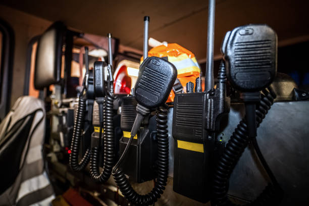 HDR - Professional communication equipment for the fire brigade Firefighter equipment in a fire truck with walkie talkie and halt stop trowel walkie talkie photos stock pictures, royalty-free photos & images