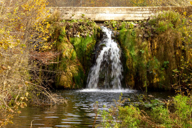 istock Small waterfall on Grza river in autumn 1062207594