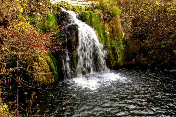 istock Small waterfall on Grza river in autumn 1062207636