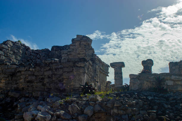 A view of Mayan ruins near Tulum in Mexico. The ruins are home to a large variety of Iguanas who perch on the walls and roof of the ruins to catch the sun.