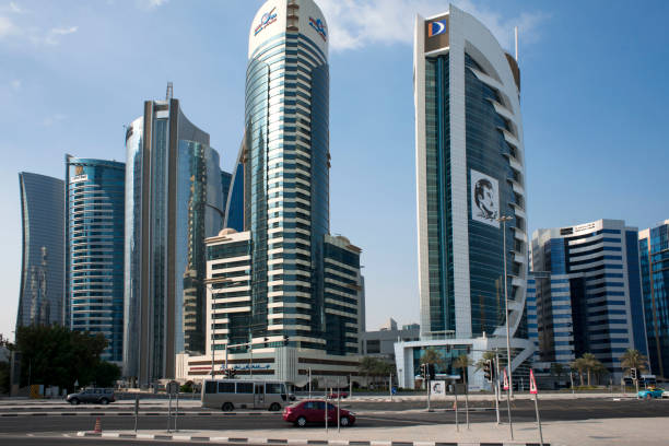 Qatar Doha Bank in the financial area of Doha, the capital of Qatar in the Arabian Gulf country. Pictures of Qatar's Emir in Doha, many signed, showing support for the government during the Gulf crisis. qatar emir stock pictures, royalty-free photos & images