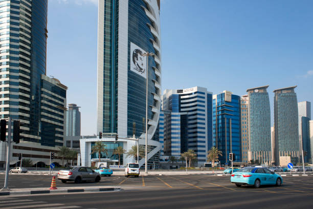 Qatar Doha Bank in the financial area of Doha, the capital of Qatar in the Arabian Gulf country. Pictures of Qatar's Emir in Doha, many signed, showing support for the government during the Gulf crisis. qatar emir stock pictures, royalty-free photos & images