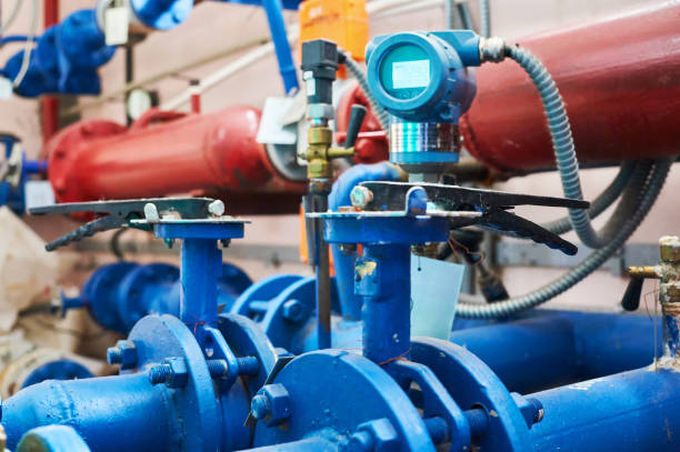 istock Valves installed on tubes painted blue. Industrial background. 1062219820