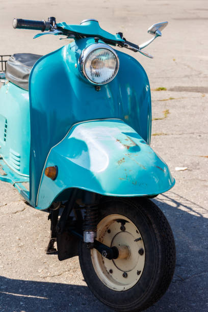 istock Blue retro scooter parked on city street 1062222176
