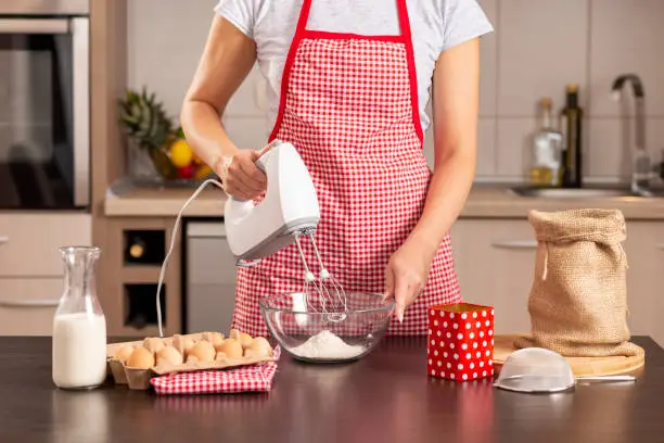Photo of Woman using a kitchen mixer