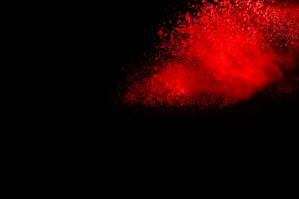 istock abstract red powder explosion on black background.abstract red powder splatted on black background. Freeze motion of red powder exploding. 1062230348
