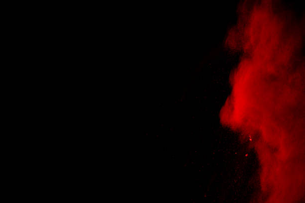 istock abstract red powder explosion on black background.abstract red powder splatted on black background. Freeze motion of red powder exploding. 1062230380