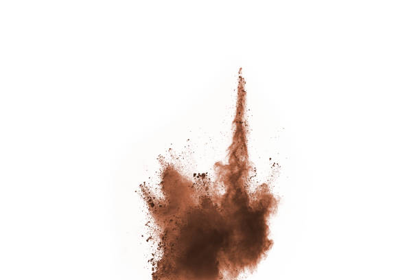 istock Brown color powder explosion on white background. Colored cloud. Colorful dust explode. Paint Holi. 1062230618