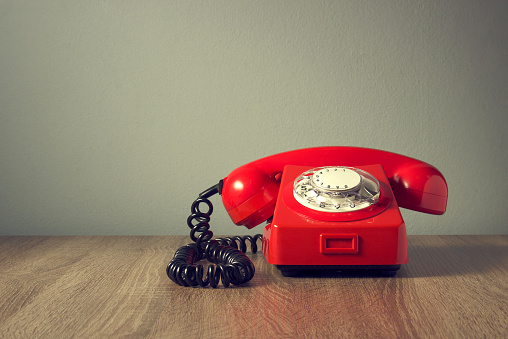 Retro, antique, old, red phone in vintage color style.