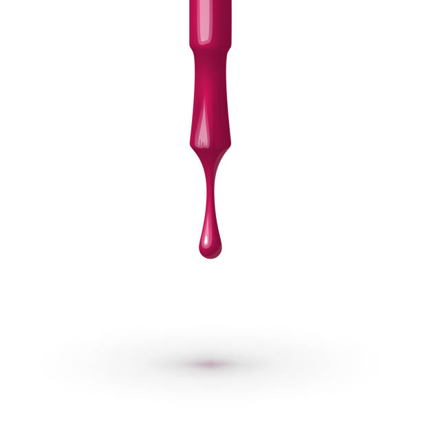 istock Pink nail polish flowing from the brush. 1062239078