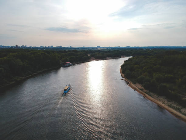 Cernavoda, Romania - May 6, 2016: The Danube–Black Sea Canal, which runs from Cernavoda, on the Danube, to Constanta. The Canal was notorious as the site of labor camps in '50s Communist Romania, when, at any given time, several tens of thousands political prisoners worked on its excavation and construction. One of the main reason(s) for the building of the canal were to circumvent the Danube Delta, which is difficult to navigate, to shorten the distance to the Black Sea, and several issues related to the loading and unloading of ships