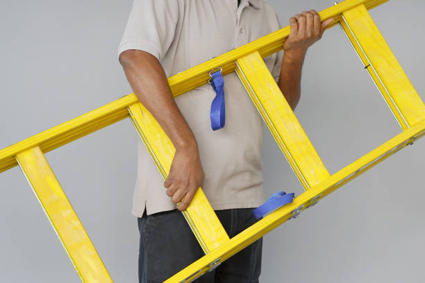 istock worker with wooden ladder 1062245242